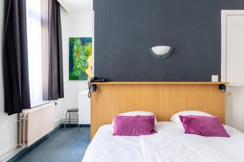 Postel nebo postele na pokoji v ubytování Hotel Montovani
