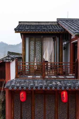 Un balcón o terraza en Ganzhou Banjiangxia Homestay