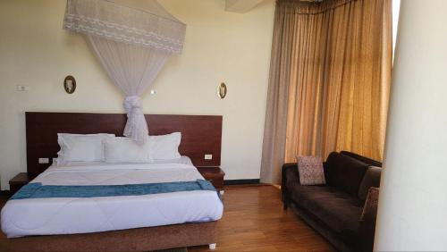 Ένα ή περισσότερα κρεβάτια σε δωμάτιο στο Yiganda Hotel, Bahir Dar