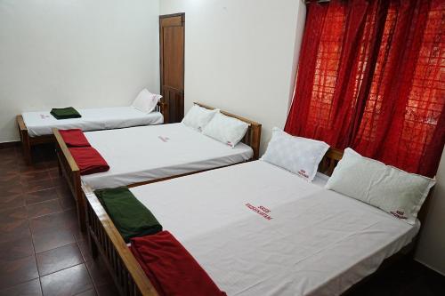 Katil atau katil-katil dalam bilik di Sree Vaishnavam Home Stay