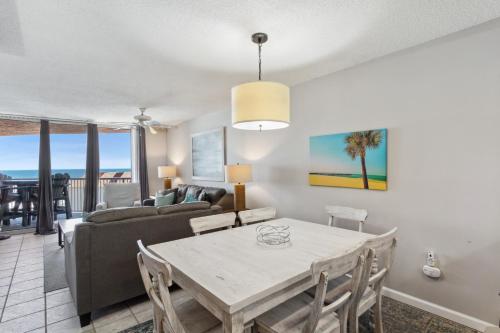 a living room with a table and a couch at Buena Vista 403 in Gulf Shores