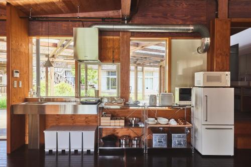 Una cocina o cocineta en MUJI BASE oikawa