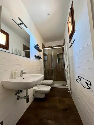 a bathroom with a sink and a toilet and a shower at Le Castellacce in Siena