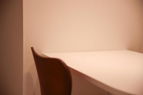 a white desk and a chair in a room at Wecostay Cheongnyangni in Seoul