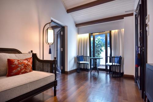 a living room with a couch and a table at Liu Men Melaka in Melaka