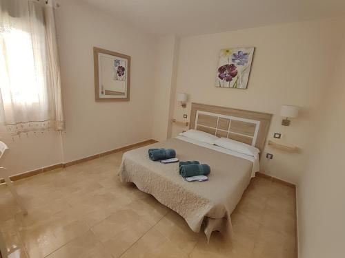 Posteľ alebo postele v izbe v ubytovaní Apartamento fuerte 1