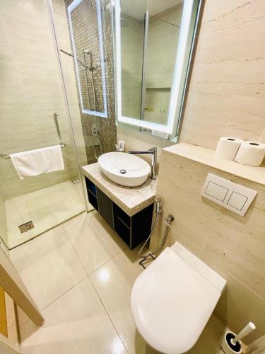 a bathroom with a toilet and a sink and a shower at My Residence Villa Star Klcc in Kuala Lumpur