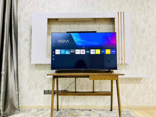 a television sitting on a table in a room at My Residence Villa Star Klcc in Kuala Lumpur