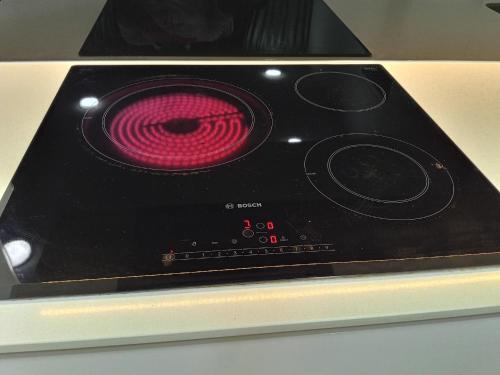 a stove with a pink stove top oven at My Residence Villa Star Klcc in Kuala Lumpur