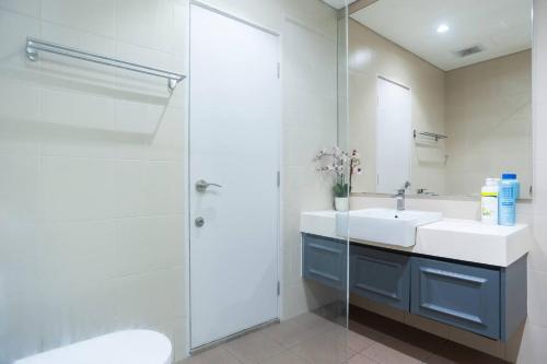 a bathroom with a sink and a shower at I-City Luxury Condominiums, Shah Alam by Smarthome in Shah Alam
