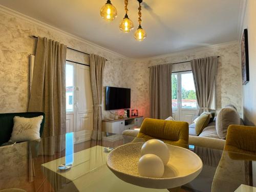 a living room with a couch and a table at Lux Downtown Reguengos in Reguengos de Monsaraz
