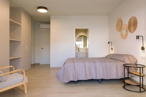 Ένα ή περισσότερα κρεβάτια σε δωμάτιο στο Joyma Boutique Apartments