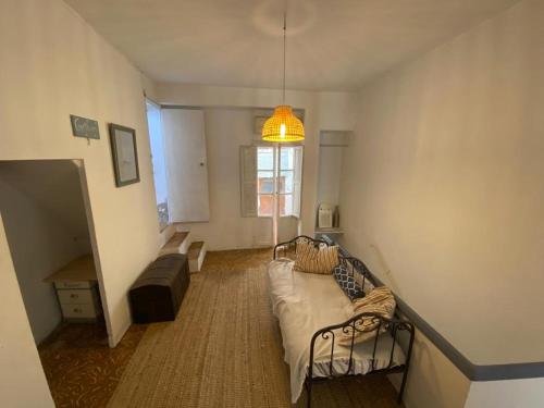 a living room with a couch and a window at Charming townhouse Oliva in Oliva