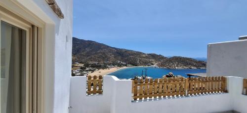 a view of a beach from a balcony of a house at Almyriki in Mylopotas