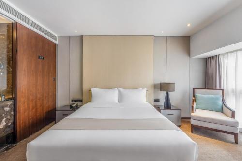Katil atau katil-katil dalam bilik di Zhonghao International Hotel