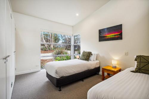 Cama o camas de una habitación en Bruny Bay House