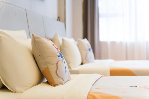 Ένα ή περισσότερα κρεβάτια σε δωμάτιο στο Atour Light Hotel Chengdu Wide-Narrow Alley
