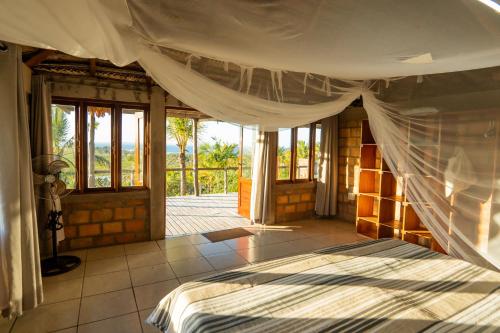 Ein Bett oder Betten in einem Zimmer der Unterkunft Sunset Lodge