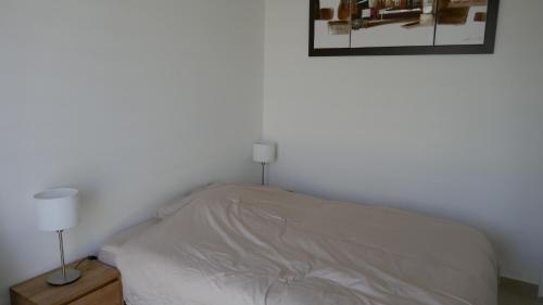 Postel nebo postele na pokoji v ubytování Ma chambre d'amis