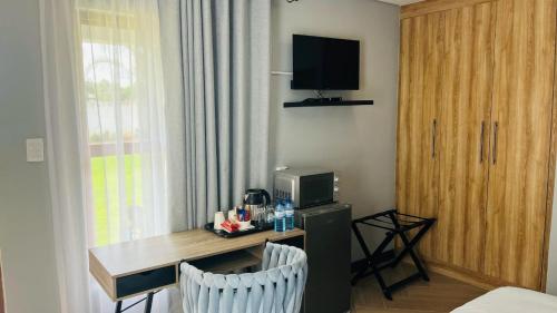 Μια τηλεόραση ή/και κέντρο ψυχαγωγίας στο Black Villa Lodge