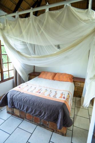 Ein Bett oder Betten in einem Zimmer der Unterkunft Sunset Lodge