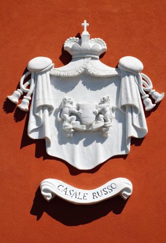 a white statue of a cross on a wall at Antico Casale Russo in Piano di Sorrento