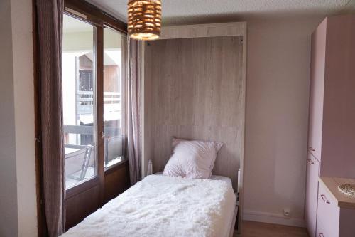 Posteľ alebo postele v izbe v ubytovaní Studio cocooning style naturel