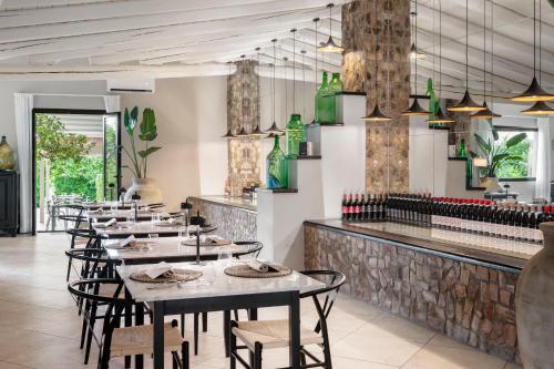 a row of tables and chairs in a restaurant at Villa Felicia in Noto