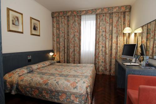 Postel nebo postele na pokoji v ubytování Park Hotel Ripaverde