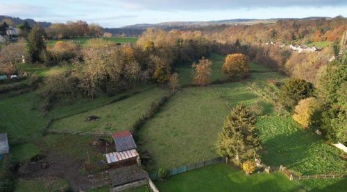 an aerial view of a large field with trees at Les bottines in Pont-d'Ouilly