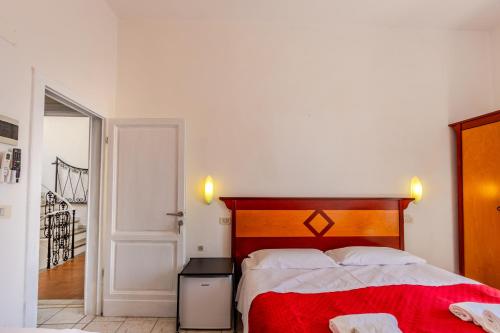 Letto o letti in una camera di Hotel Corallo Follonica