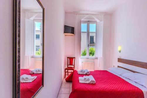 Postel nebo postele na pokoji v ubytování Hotel Corallo Follonica