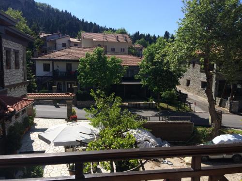 a view from a balcony of a town with buildings at Archontiko Tsiboni in Elati Trikalon