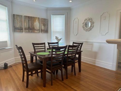 a dining room with a table and chairs at Stunning 3BR-Private Entrance-Renovated-Near City in Pittsburgh