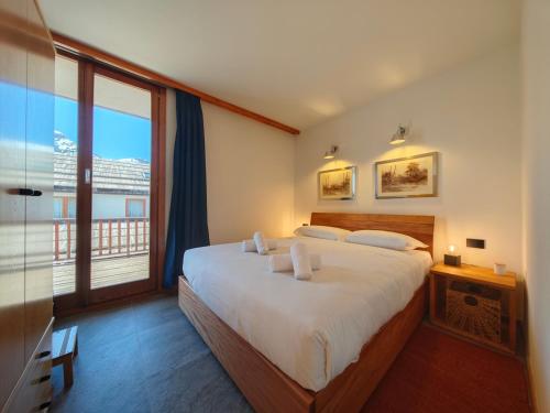 Postel nebo postele na pokoji v ubytování Hostdomus - La Piazzetta