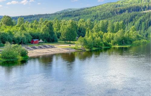 a view of a river with a house and trees at 3 Bedroom Awesome Home In Stöllet in Stöllet