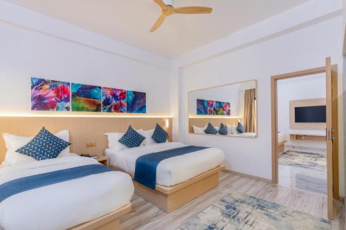 Ein Bett oder Betten in einem Zimmer der Unterkunft Arrival Beach and Spa