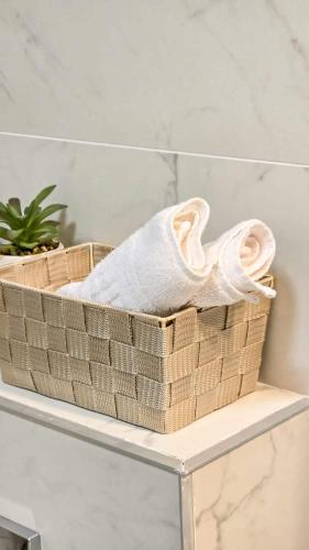 a basket sitting on top of a white shelf at Blvd Ivory Pipera Studio 43A in Voluntari