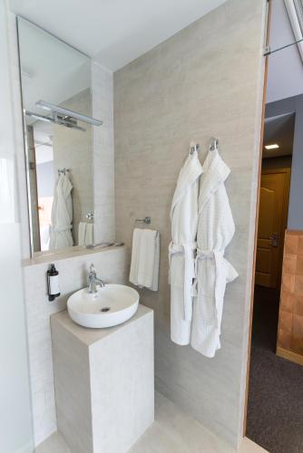 a bathroom with a sink and a mirror at Amante Narikala Boutique Hotel in Tbilisi City
