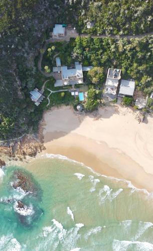 an aerial view of a house on a beach at Buccara Noetzie - Pezula Castle in Knysna
