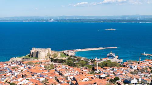 an aerial view of a town next to the water at Dione Bozcaada in Bozcaada