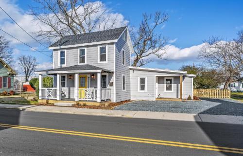 a white house on the side of a street at Hudson House in Chincoteague