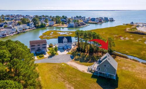 an aerial view of a house on an island in the water at The Baywatch Bungalow in Greenbackville