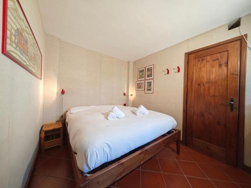 Ένα ή περισσότερα κρεβάτια σε δωμάτιο στο Hostdomus - Ski Golf