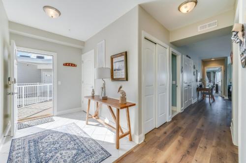 a home office with a table and a hallway at Sunset Bay Villa 319 - Bella Vista in Chincoteague