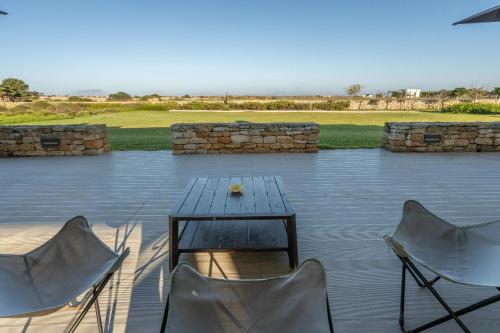 a table and two chairs on a patio at Villa Partenope in Favignana