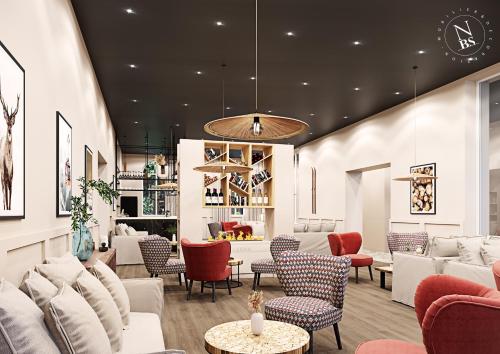 a lobby with couches and chairs in a store at Garrigae Caserne de Briançon & SPA Cinq Mondes in Briançon