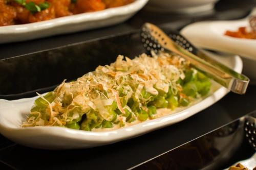 a plate of food sitting on a table with a plate of food at les suites taipei ching cheng in Taipei