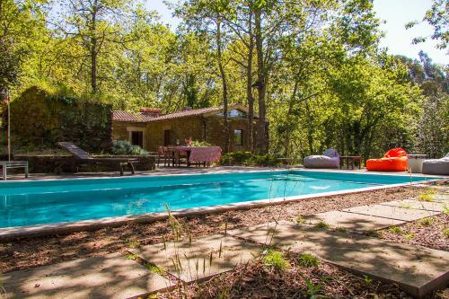 a swimming pool in the yard of a house at Liiiving in Caminha | Oak Tree Chill House in Caminha