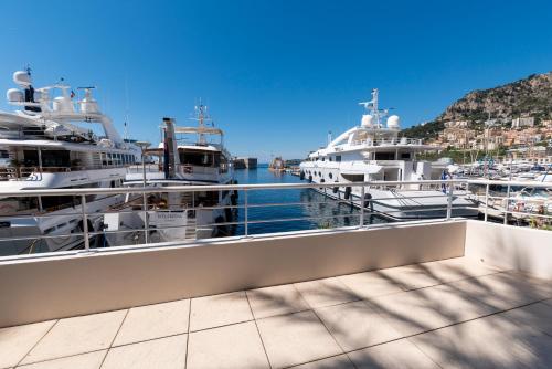 a group of boats docked at a marina at Résidence Cap Winston in Cap d'Ail